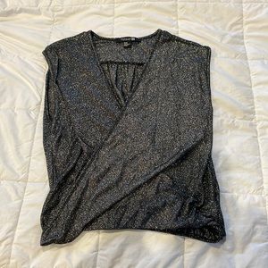 Low v-neck cut glittery sleeveless shirt